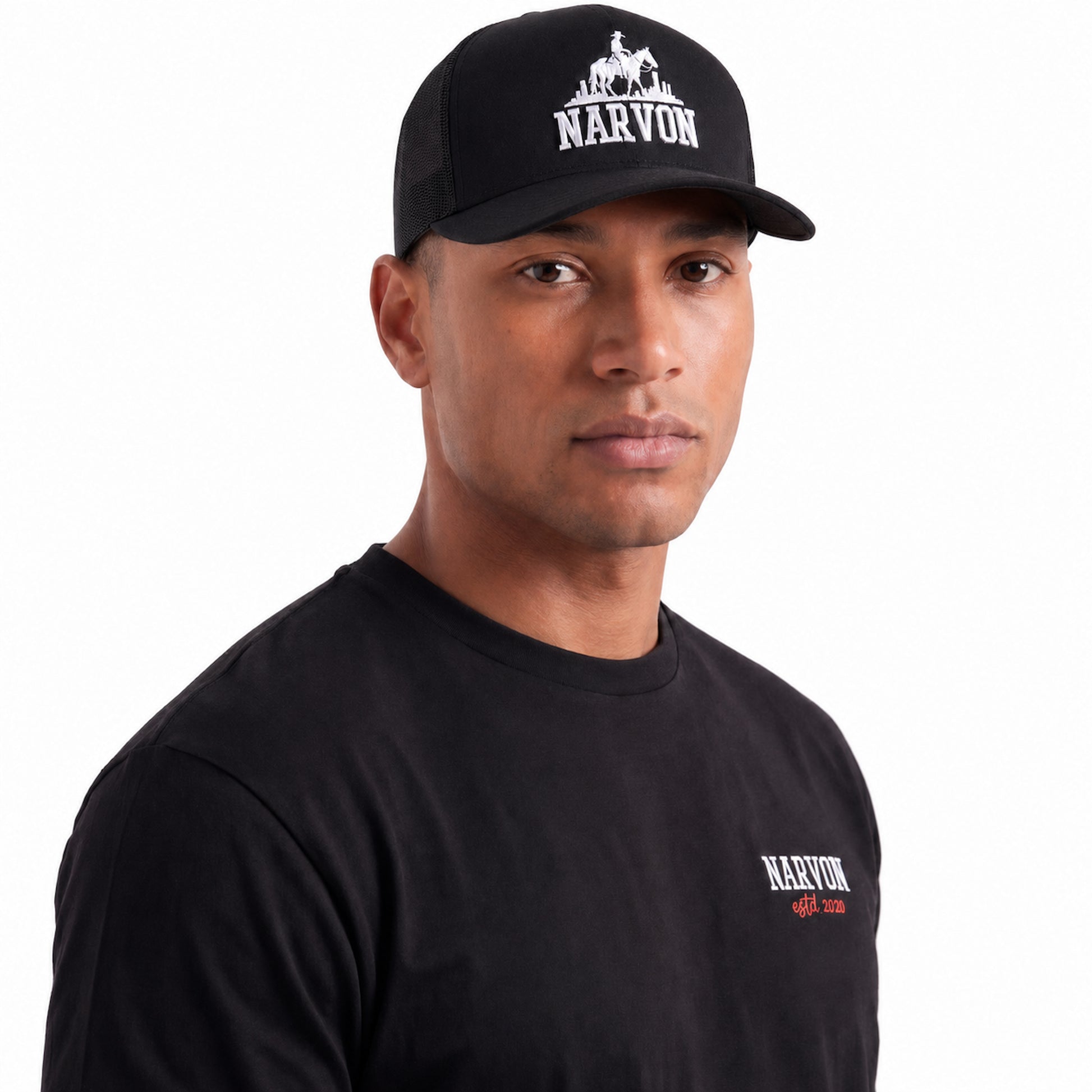 Mens black trucker cap styled in a casual outfit with curved brim and structured front panel