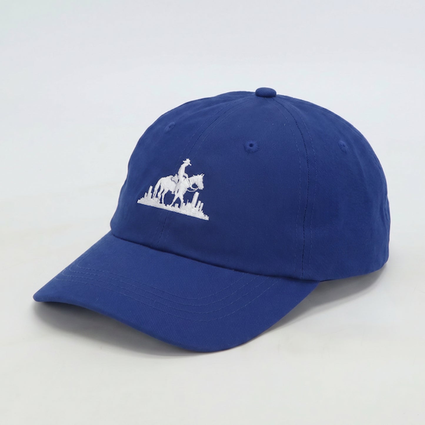 Men’s royal blue dad cap side profile with curved brim and structured cotton fit