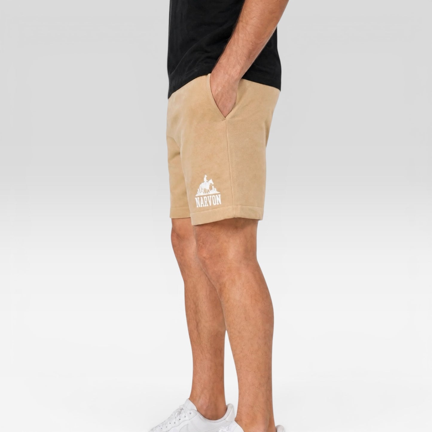 Side view of men’s beige cotton shorts with relaxed fit and minimalist casual design