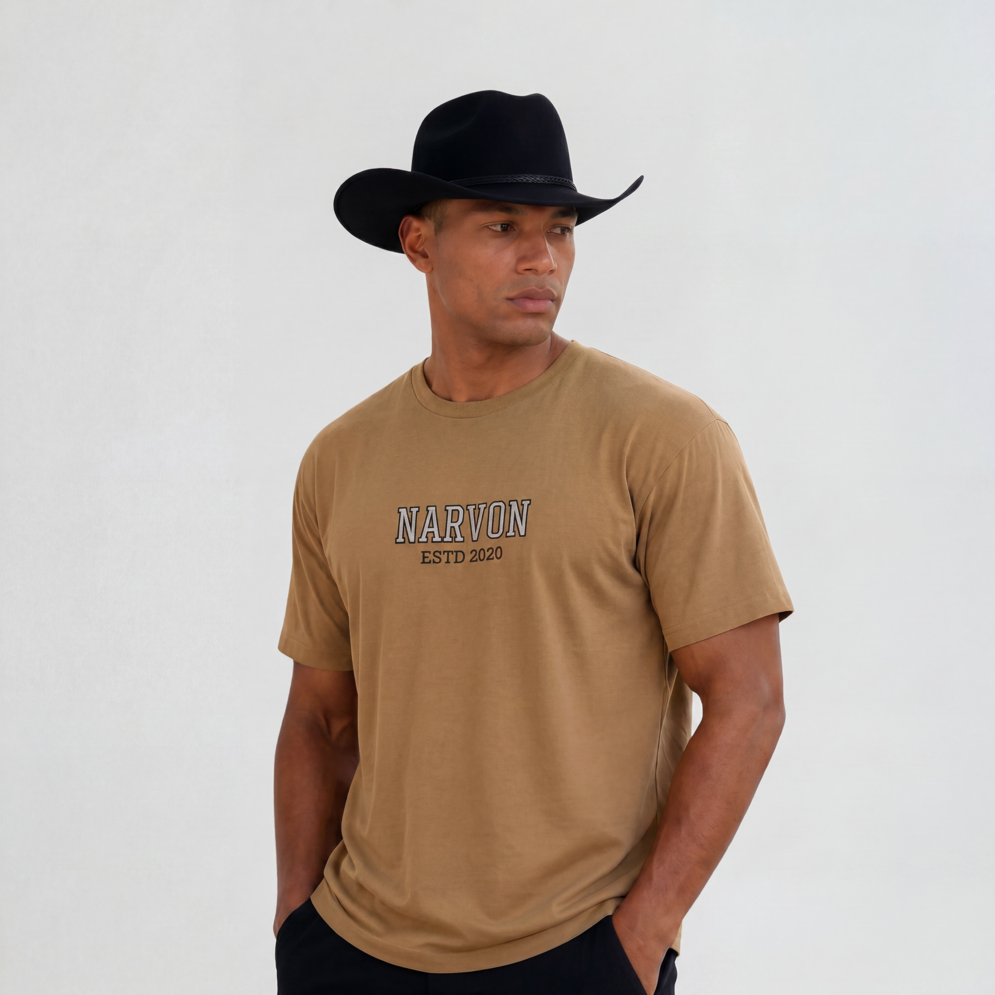 Men wearing a brown cotton t-shirt with relaxed fit in a country western inspired outfit