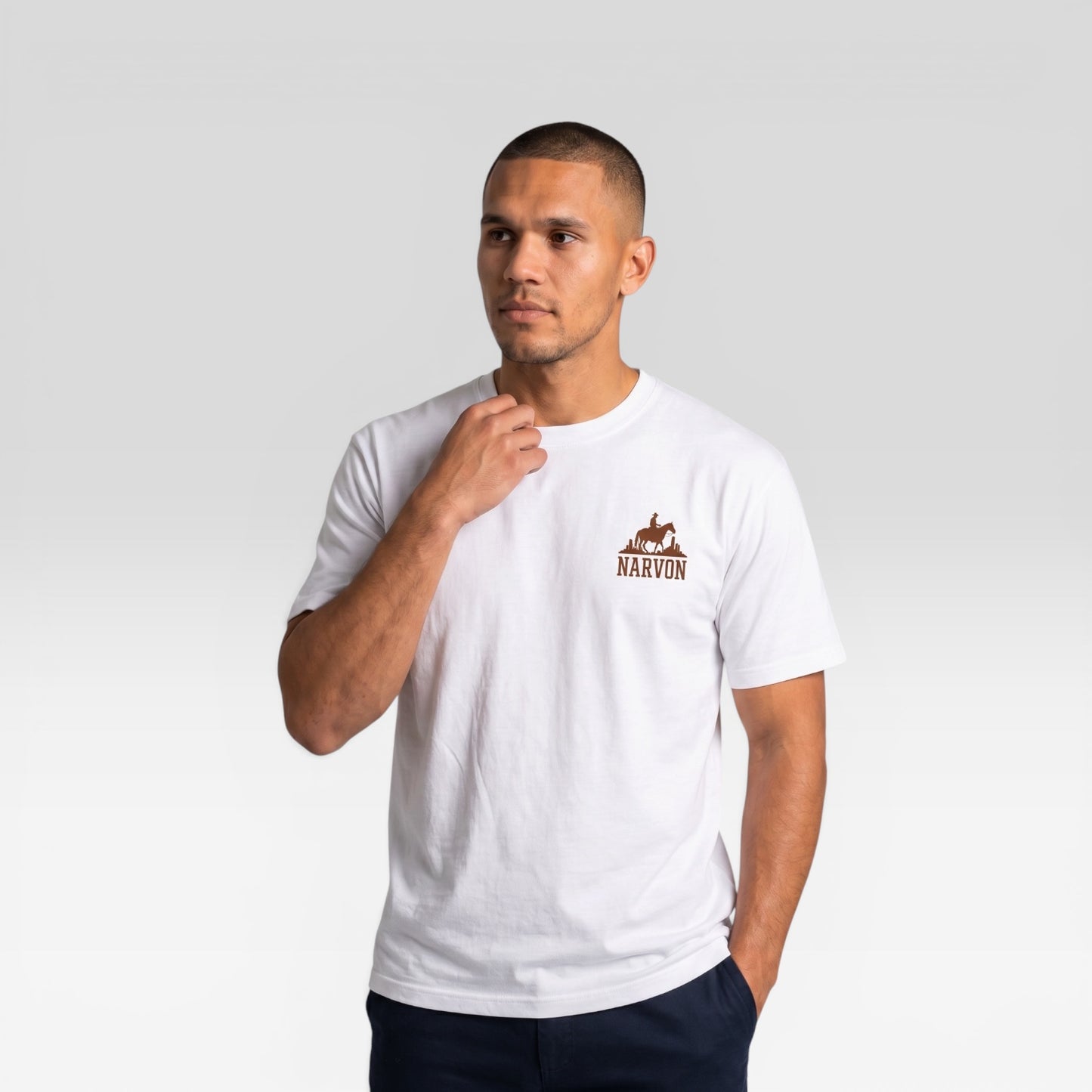 Men’s white minimal cotton t-shirt with relaxed fit styled in a clean modern look