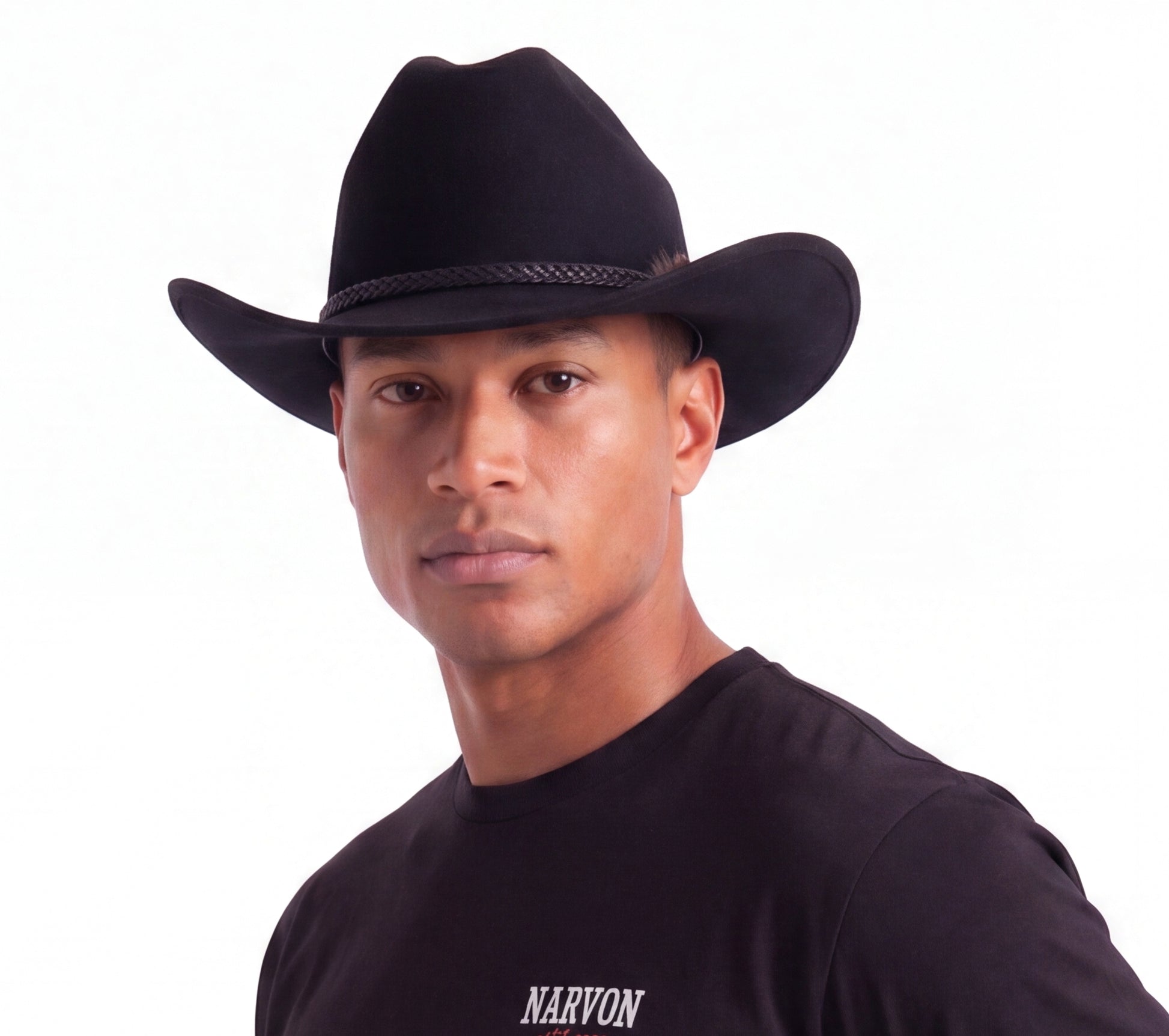 Mens black cowboy hat styled in a modern western outfit side profile view
