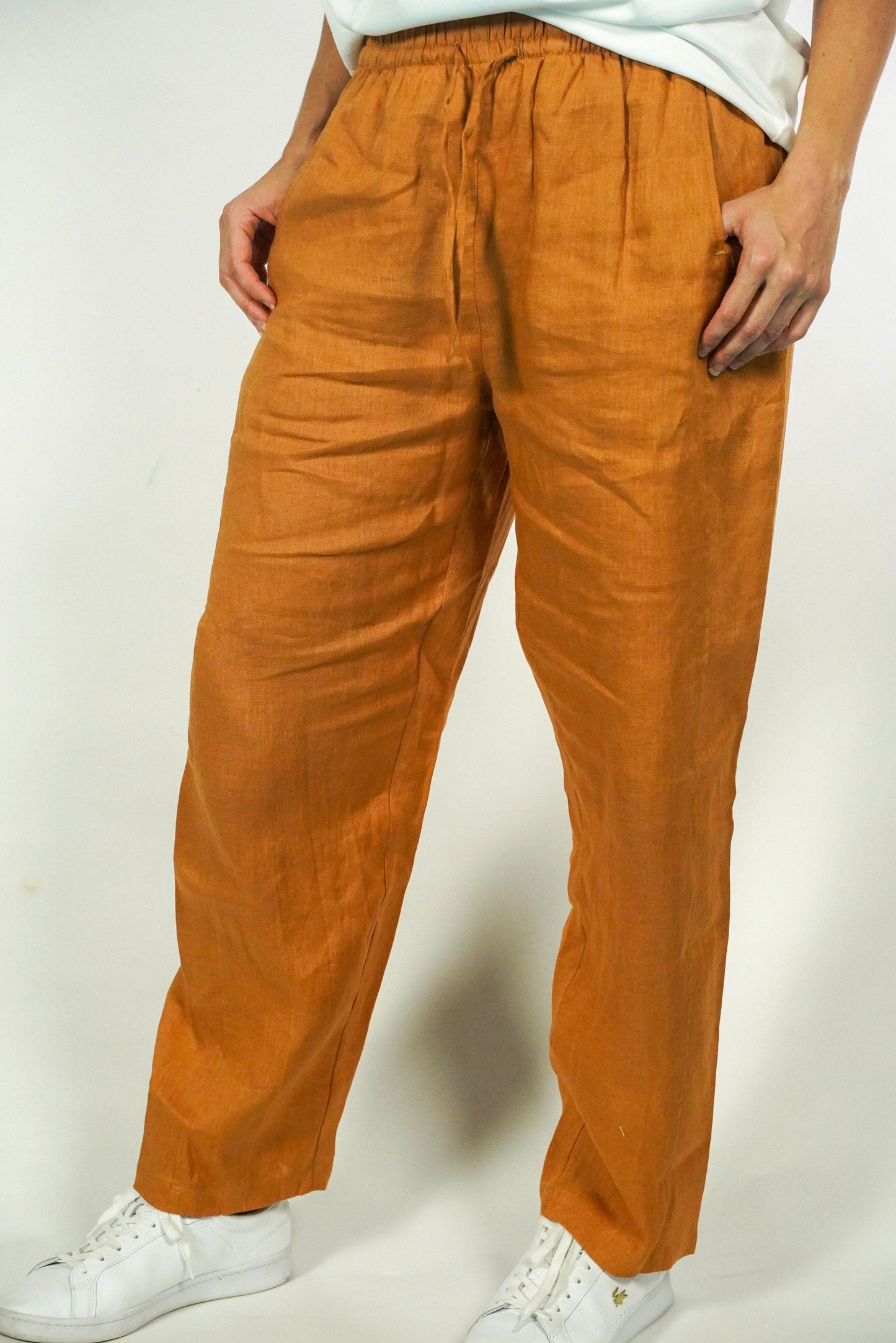 Narvon brown linen relaxed pants, premium lightweight fabric with stretch waist and pockets. 
