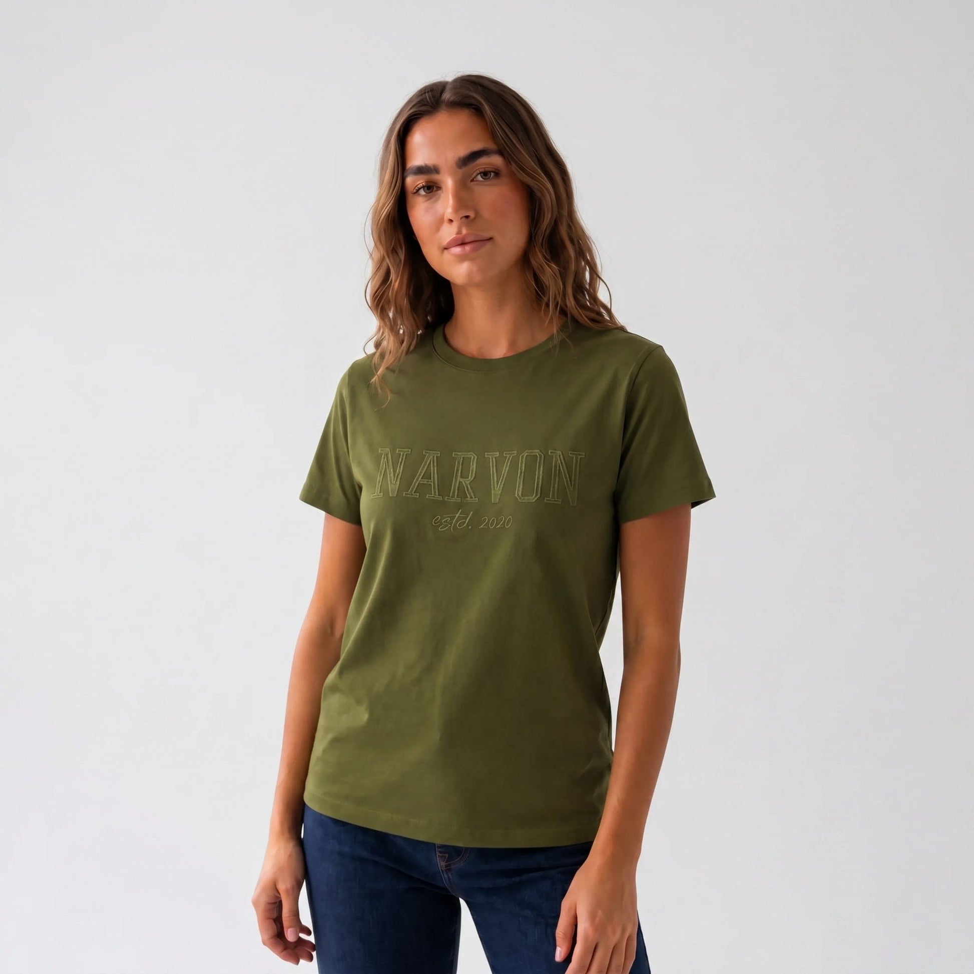 Women’s olive green cotton t-shirt with relaxed fit and minimal logo in a clean everyday look