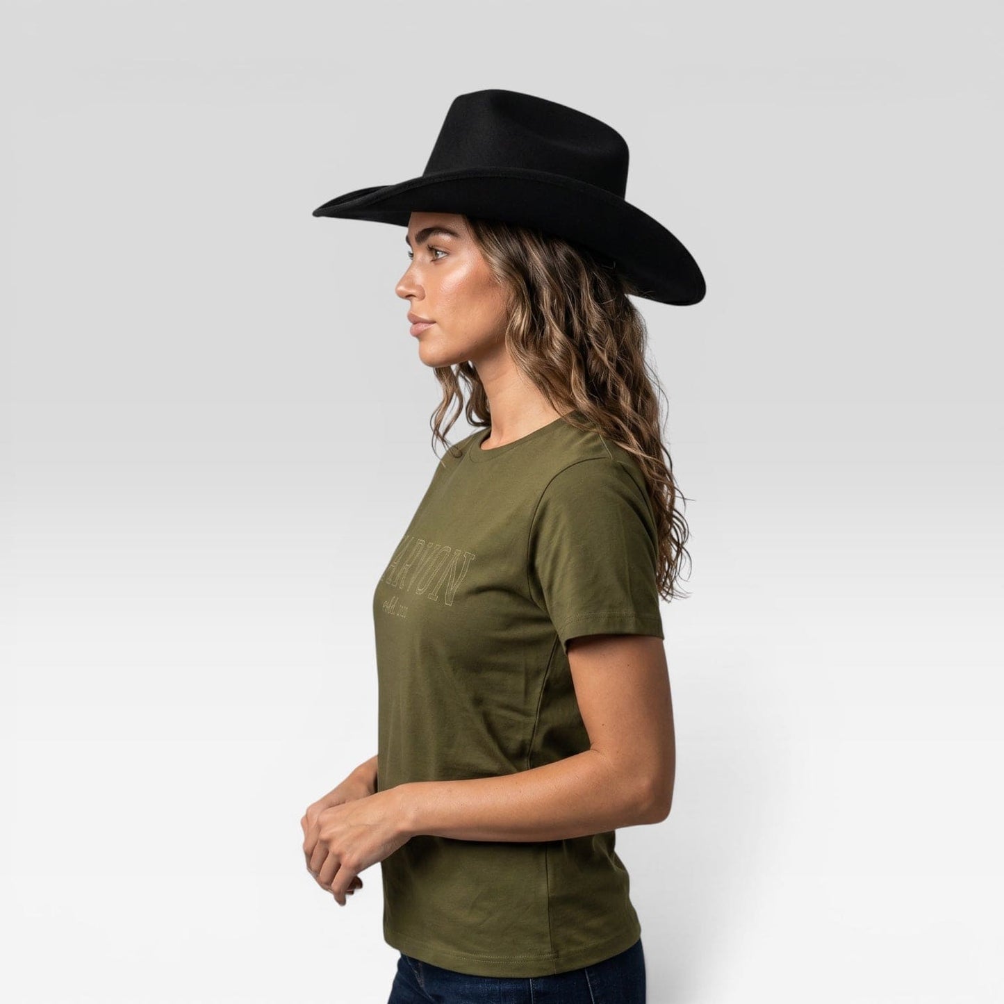 Side view of women’s olive green cotton t-shirt with relaxed fit styled casually