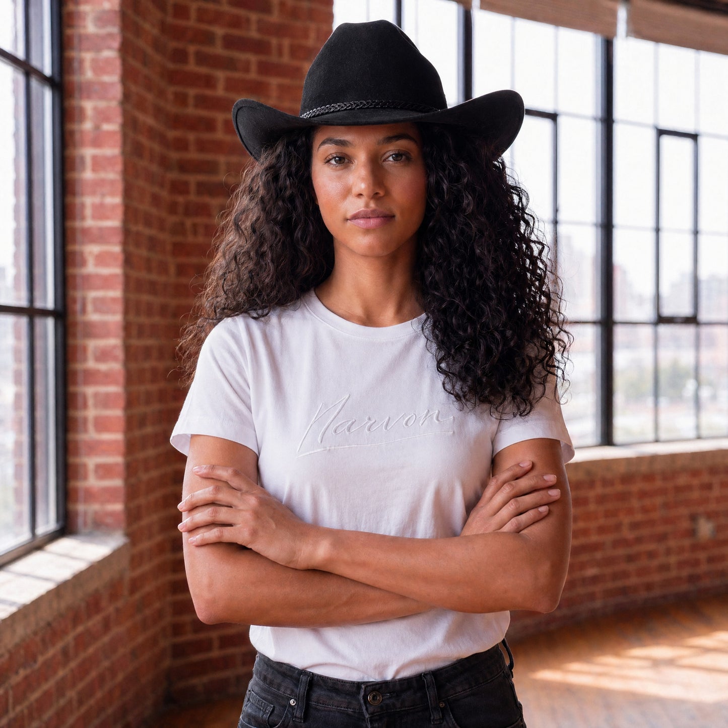 Women’s white cotton t-shirt with relaxed fit and minimal branding in a modern everyday look
