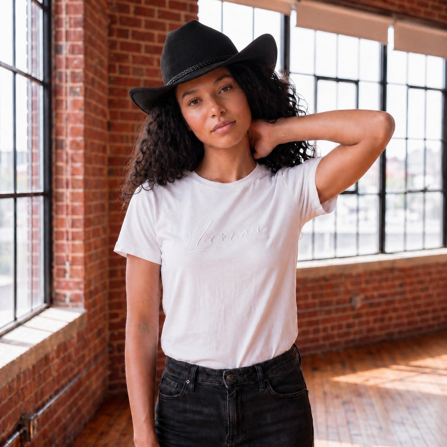 Women’s white cotton t-shirt with relaxed fit and minimal design in a clean casual style